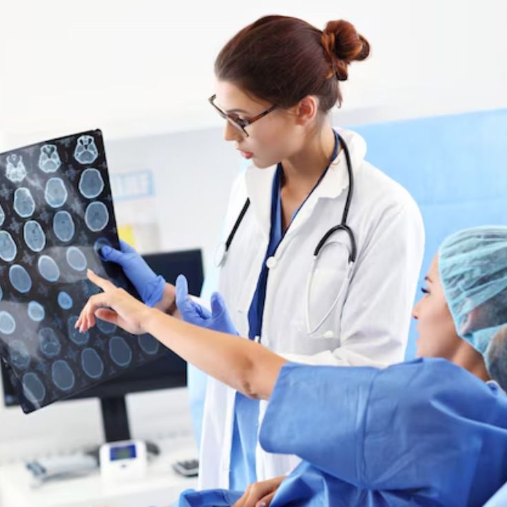 Neurologist reviewing brain scan images with a patient